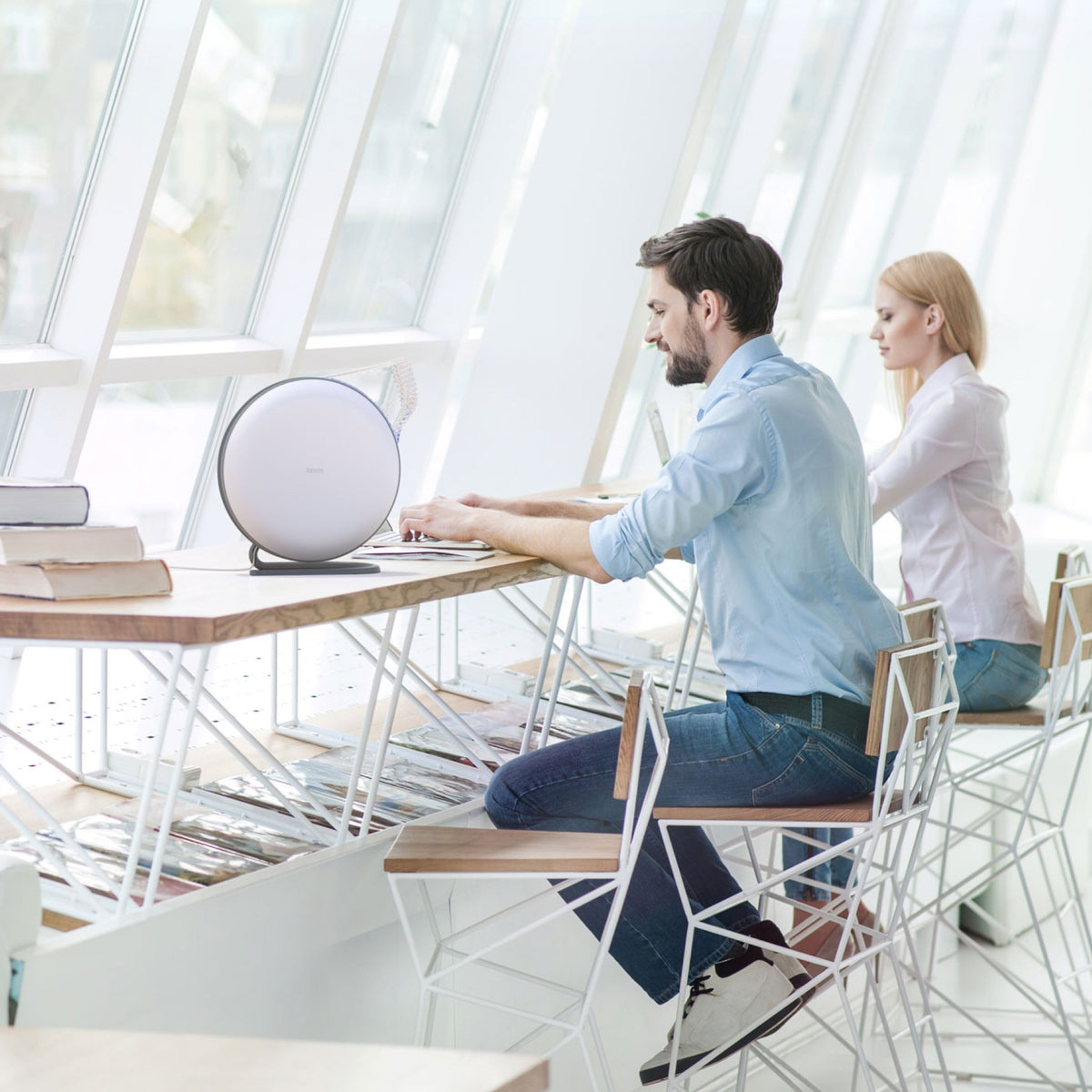 Atem Desk next to man and woman on desk